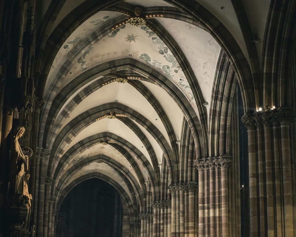a large cathedral with a statue in the middle of it