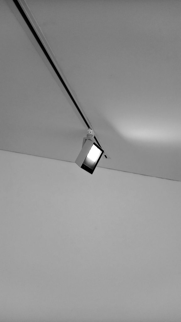 a black and white photo of a light fixture