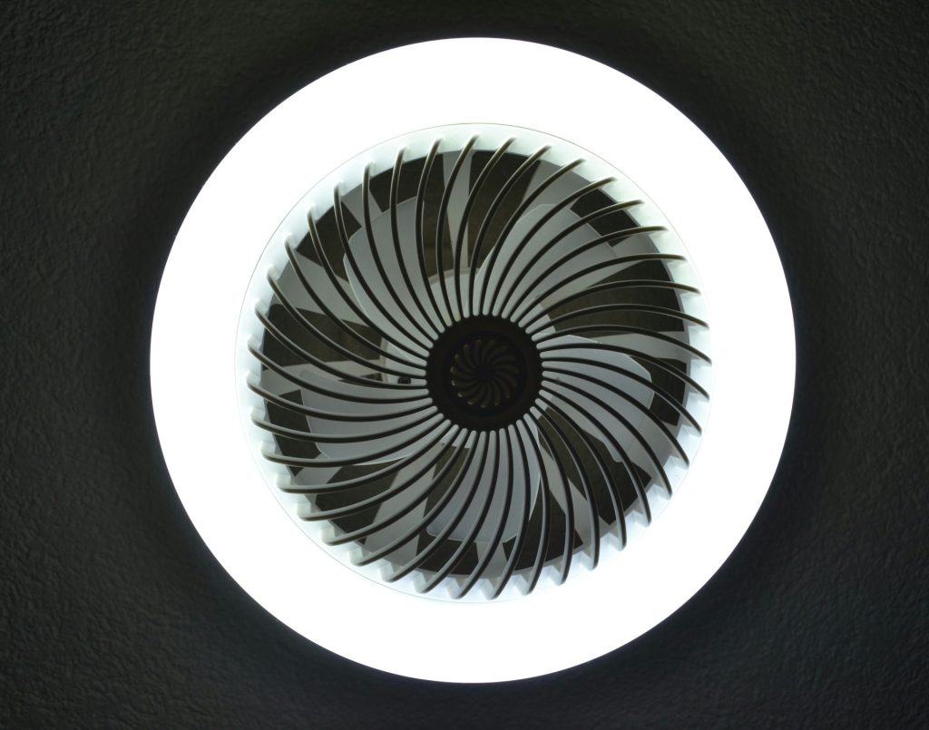 A circular fan with swirling blades.